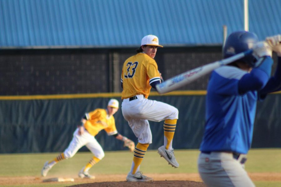 Sophomore pitcher Cole Spain winds up to deliver a pitch against Washington and Lee on Feb. 9, 2019