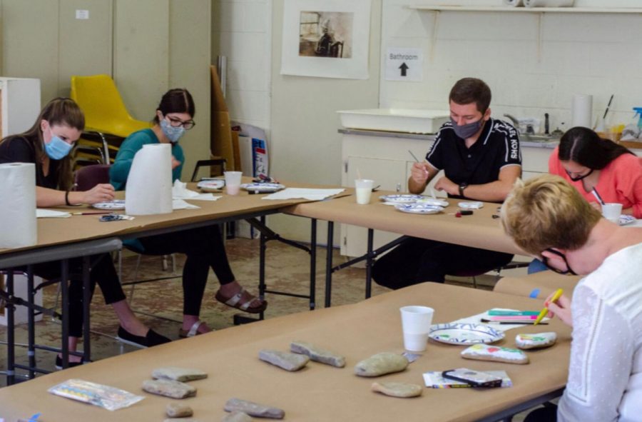 "French 203 participating in rock painting at the Danville Museum of Fine Arts and History."