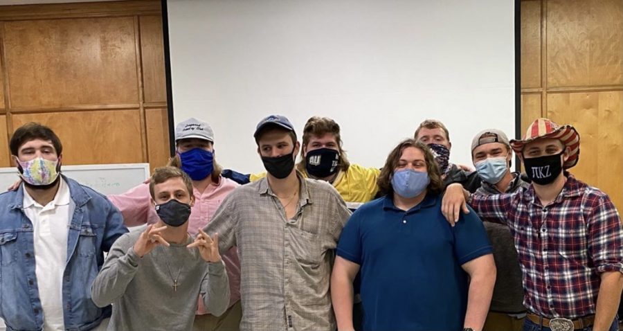 Members of the PKZ fraternitys executive board pose for a picture during one of the weekly meetings. The weekly meetings involve planning events, going over information, and more.