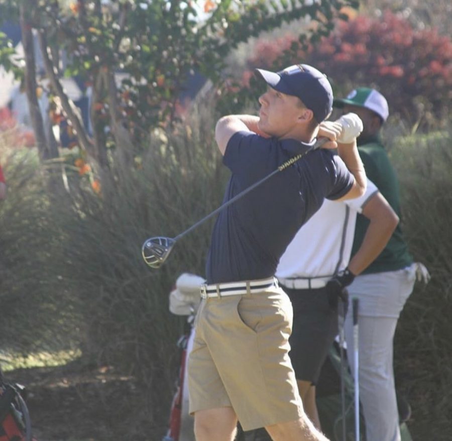 Junior Caleb Kimbrough tees off during a golf tournament.