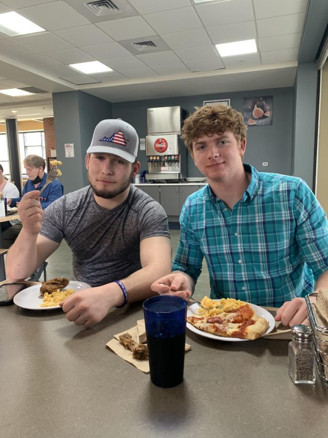 Aaron Haley, sophomore, and  Jonathan Bishop, senior, have lunch in the cafe.